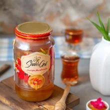 عسل شیشه مینا 1400 گرمی باموم شهرگل